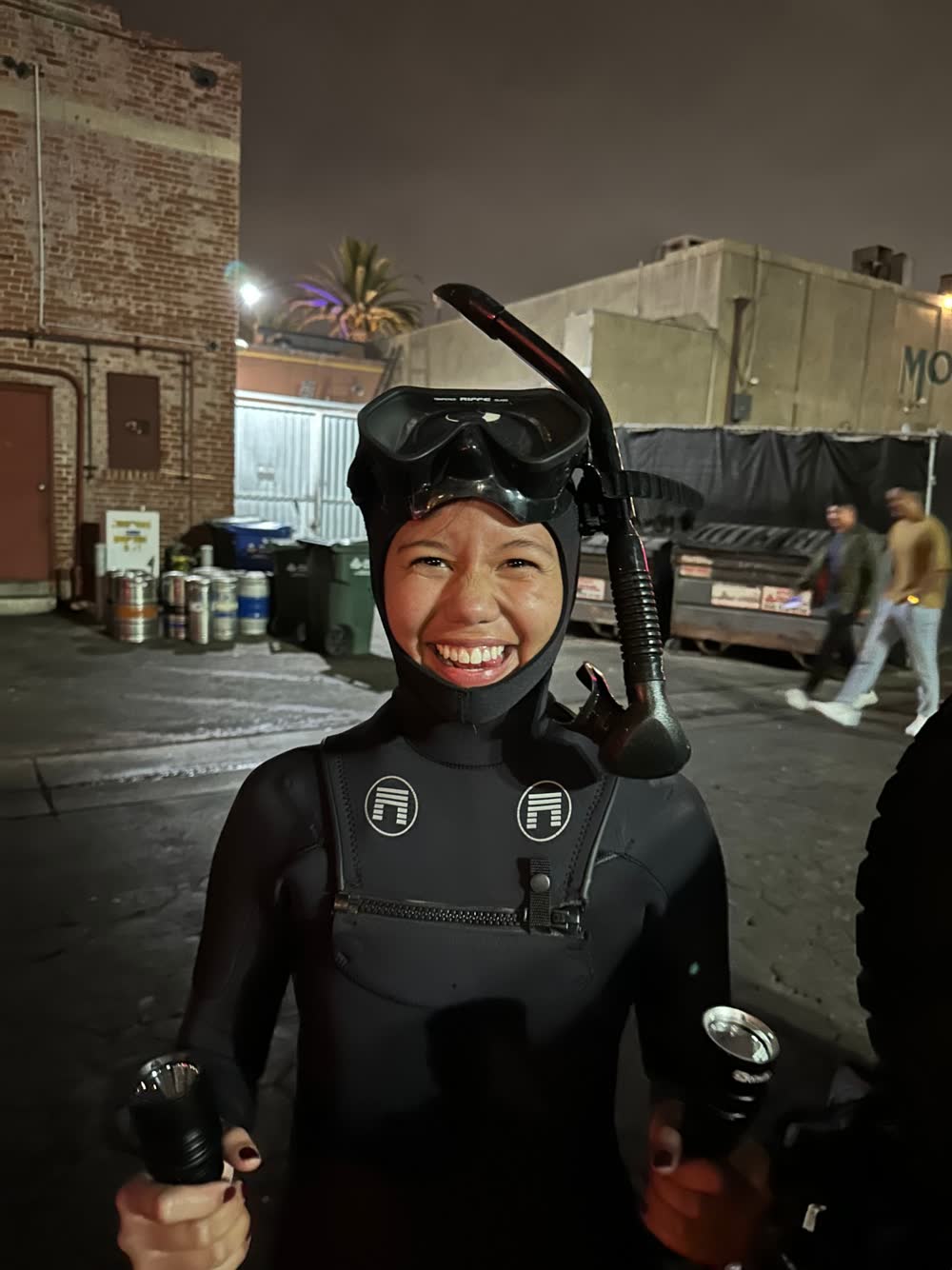 Mal Corpuz geared up with mask and lights before a night dive